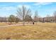 Community park with lush green space and walking paths, perfect for outdoor activities and enjoying nature at 9369 Longs Peak Dr, Henderson, CO 80640