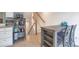 Cozy dining area adjacent to the kitchen with a view of the staircase and lots of natural light at 9369 Longs Peak Dr, Henderson, CO 80640