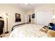 Bedroom featuring a bed, tv, and sliding closet doors at 22405 E Plymouth Cir, Aurora, CO 80016