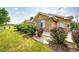 Well-maintained home featuring manicured landscaping, stone accents, and a welcoming front entrance at 22405 E Plymouth Cir, Aurora, CO 80016