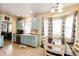 Charming kitchen area with modern appliances, and adjacent dining area for convenience at 22405 E Plymouth Cir, Aurora, CO 80016