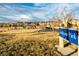 Picturesque Larkspur Park entrance, featuring a playground, picnic tables, and vast open spaces at 22405 E Plymouth Cir, Aurora, CO 80016