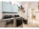 Laundry room with modern washer and dryer at 22405 E Plymouth Cir, Aurora, CO 80016