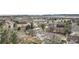 A lovely neighborhood surrounded by trees and nearby buildings, as seen from above at 831 W Kettle Ave, Littleton, CO 80120