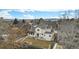 Aerial view of a two-story home featuring an expansive backyard and mountain views at 831 W Kettle Ave, Littleton, CO 80120