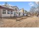 Spacious backyard with pergola, grass, and wood fence, perfect for outdoor activities at 831 W Kettle Ave, Littleton, CO 80120