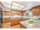 Kitchen featuring granite countertops, wood floors, and ample cabinet space at 831 W Kettle Ave, Littleton, CO 80120