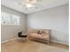 Neutral bedroom with a crib and adjacent window, filled with natural light at 6459 E Mineral Dr, Centennial, CO 80112