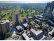 Aerial view of city, showing golf course, mature trees, and surrounding residential buildings at 33 N Corona St # 205, Denver, CO 80218