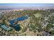 Picturesque aerial view features a tranquil lake with lush greenery and scenic walking paths, providing a peaceful retreat at 33 N Corona St # 205, Denver, CO 80218