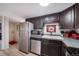 A galley kitchen boasts stainless appliances and ample cabinet storage at 33 N Corona St # 205, Denver, CO 80218