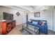 Cozy living room with a blue couch and a glass coffee table at 33 N Corona St # 205, Denver, CO 80218