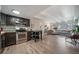 Cozy open-concept kitchen and living room with hardwood floors and plenty of natural light at 33 N Corona St # 205, Denver, CO 80218