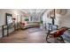 Bright living room with beamed ceilings, hardwood floors, and a comfortable curved sofa at 33 N Corona St # 205, Denver, CO 80218