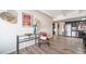Open-concept living area showcasing hardwood floors, leading to a kitchen with stainless steel appliances at 33 N Corona St # 205, Denver, CO 80218