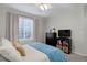 Cozy bedroom with a ceiling fan, window, and storage, offering comfort and functionality at 2347 Switch Grass Way, Castle Rock, CO 80109