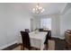 Bright dining room with hardwood floors and stylish chandelier at 2347 Switch Grass Way, Castle Rock, CO 80109