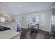 Open kitchen with stainless steel appliances and a dining area with a bay window at 2347 Switch Grass Way, Castle Rock, CO 80109