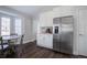 Kitchen with white cabinetry, stainless steel appliances, and a nearby breakfast nook at 2347 Switch Grass Way, Castle Rock, CO 80109