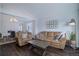 Bright and open living room featuring dark wood floors and modern decor at 2347 Switch Grass Way, Castle Rock, CO 80109