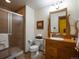 Bathroom featuring a stand-up shower with a glass door and wood vanity at 76 Raven Ridge Rd, Idaho Springs, CO 80452