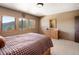 Bedroom with three windows offering natural light and scenic mountain views at 76 Raven Ridge Rd, Idaho Springs, CO 80452