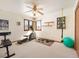 An exercise room filled with equipment and natural light streaming through windows at 76 Raven Ridge Rd, Idaho Springs, CO 80452