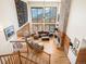 Spacious living room with high ceilings, a stone fireplace, hardwood floors, and beautiful mountain views at 76 Raven Ridge Rd, Idaho Springs, CO 80452