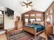 Spacious primary bedroom with wood floors, a vaulted ceiling, large windows, and mountain views at 76 Raven Ridge Rd, Idaho Springs, CO 80452