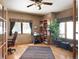 Office space features hardwood floors, large windows, and a built-in bookcase at 76 Raven Ridge Rd, Idaho Springs, CO 80452