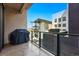 Balcony view with grill features glass railings, an urban setting, and glimpses of scenic surroundings at 250 Columbine St # 310, Denver, CO 80206