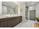 Modern bathroom features a double sink vanity, sleek fixtures and a glass shower at 250 Columbine St # 310, Denver, CO 80206