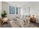 Bright bedroom featuring a cozy rug, modern furniture, and soothing artwork at 250 Columbine St # 310, Denver, CO 80206