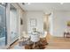 Bright dining area with hardwood floors, glass table, and sliding glass door to balcony at 250 Columbine St # 310, Denver, CO 80206