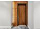 Stylish wood-paneled front door with modern hardware and unit number 310 at 250 Columbine St # 310, Denver, CO 80206