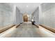 Wide hallway with tile flooring, wood accents, and decorative lighting features for a modern look at 250 Columbine St # 310, Denver, CO 80206