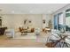 Spacious living room and dining area with hardwood floors, modern decor, and bright, natural light at 250 Columbine St # 310, Denver, CO 80206