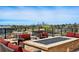 Rooftop deck lounge area with fire pit and plush seating with an attractive skyline view at 250 Columbine St # 310, Denver, CO 80206