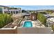 Aerial view of a rooftop pool area with lounge chairs and scenic views of the city at 250 Columbine St # 310, Denver, CO 80206