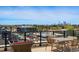Enjoy outdoor living with city views from a rooftop lounge area with table and chairs at 250 Columbine St # 310, Denver, CO 80206
