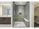 Elegant glass enclosed shower featuring stylish tile work, a built-in bench and shower head at 250 Columbine St # 310, Denver, CO 80206