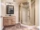 Bathroom featuring a glass enclosed shower and oak vanity at 2141 Weatherstone Cir, Highlands Ranch, CO 80126