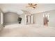 Large, bright bedroom featuring vaulted ceilings and multiple doorways leading to other rooms at 2141 Weatherstone Cir, Highlands Ranch, CO 80126
