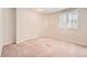 Carpeted bedroom featuring a window with blinds at 2141 Weatherstone Cir, Highlands Ranch, CO 80126