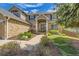 Charming home featuring manicured landscaping and a welcoming entranceway leading to the front door at 2141 Weatherstone Cir, Highlands Ranch, CO 80126