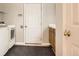 Laundry room with a washer and dryer near the back door at 2141 Weatherstone Cir, Highlands Ranch, CO 80126