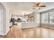 Sunlit open-concept living area with a bright kitchen, hardwood floors and great natural light at 2141 Weatherstone Cir, Highlands Ranch, CO 80126