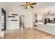 Spacious living room with hardwood floors offering an open view to the kitchen and easy patio access at 2141 Weatherstone Cir, Highlands Ranch, CO 80126