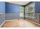 Charming room with wooden floors, decorative wallpaper, and ample light from large windows at 2141 Weatherstone Cir, Highlands Ranch, CO 80126