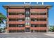 Multi-story brick apartment building with balconies and symmetrical design, creating a sense of balanced living at 3047 W 47Th Ave # 109, Denver, CO 80211